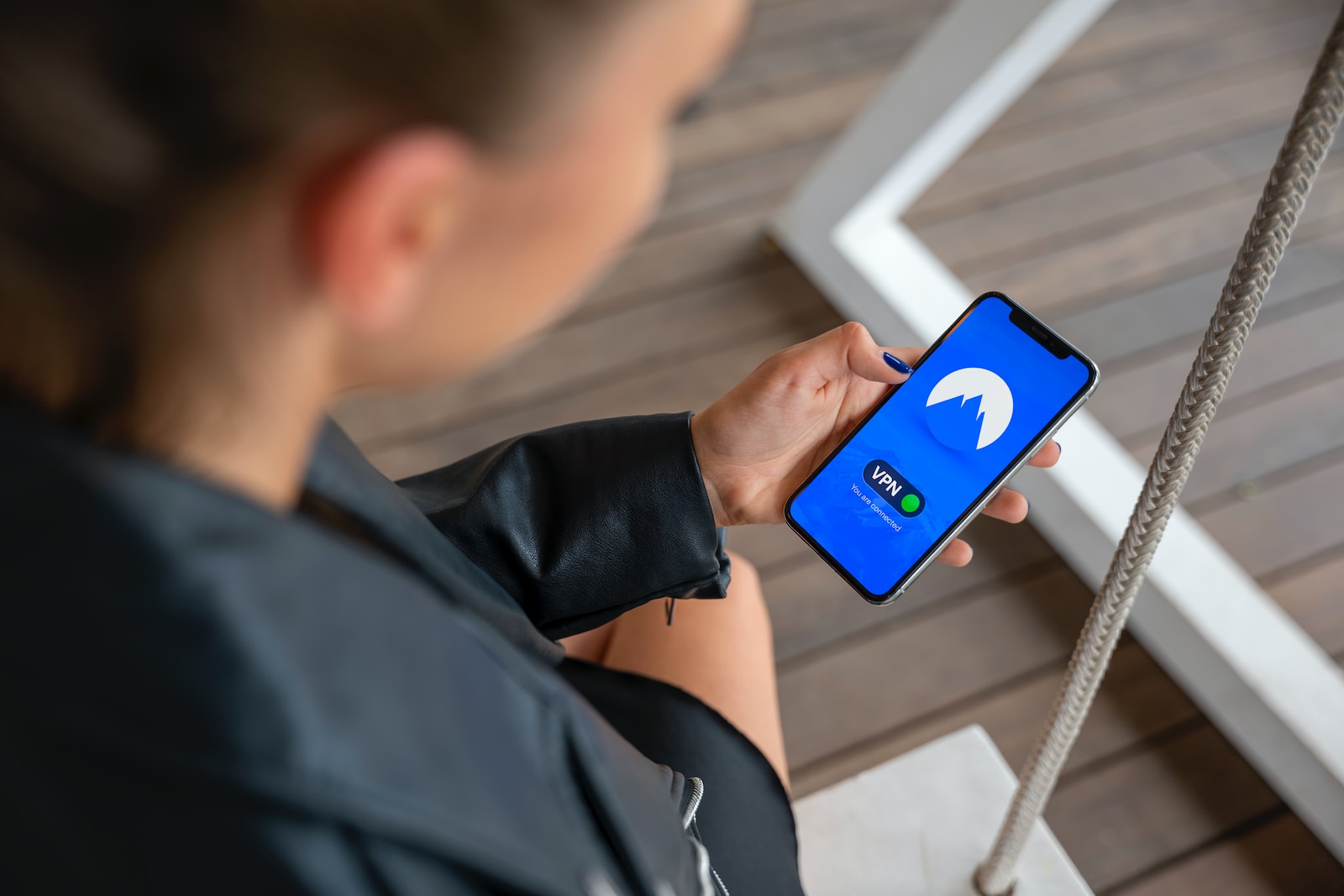 boy in black long sleeve shirt holding blue and white nintendo switch